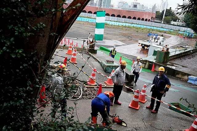 Workers are seen at the site 