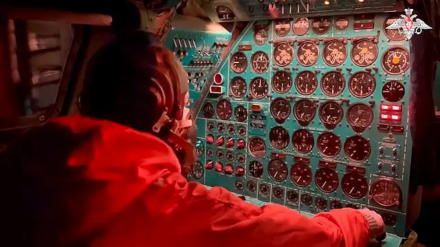 A Russian air force crew member oversees an instrument panel on board a Tu-95 nuclear-capable strategic bomber during drills of Russia’s nuclear forces