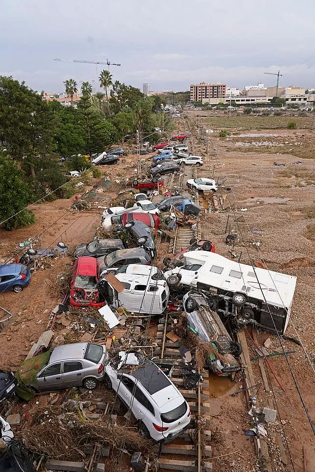 Vehicles are strewn across railway tracks 