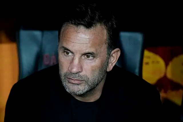 Galatasaray head coach Okan Buruk watches during the Europa League match between Galatasaray and Tottenham