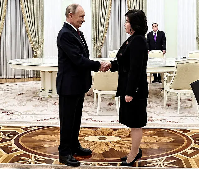 Vladimir Putin greets North Korean foreign minister Choe Son Hui during their meeting at the Kremlin