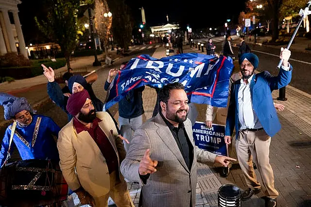 Supporters of Republican presidential nominee Donald Trump dancing outside the White House in Washington DC