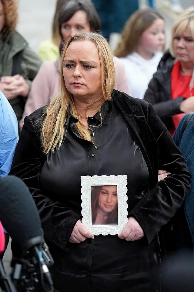 Donna Harper holding a picture of daughter Leona