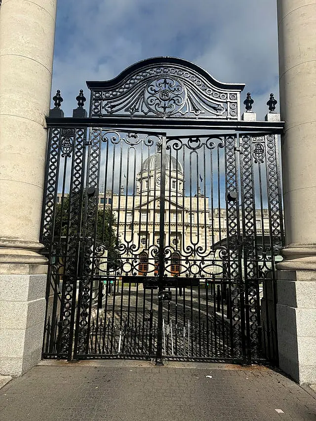 Damage at the bottom of large black gates