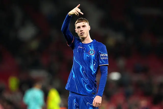 Cole Palmer salutes the Chelsea fans at Old Trafford