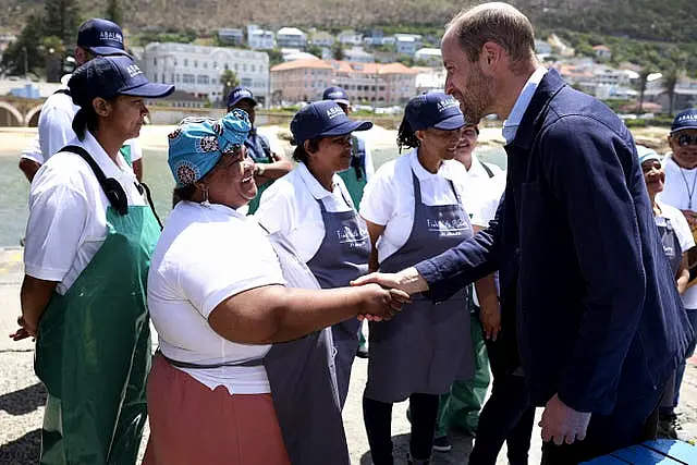 The Prince of Wales meeting local fishermen in Kalk Bay Harbour, Cape Town, to highlight the contributions of 2023 Earthshot finalist Abalobi, on the last day of his visit to South Africa