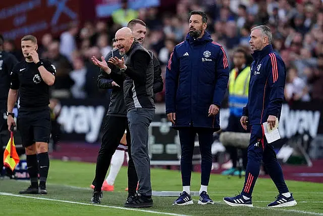 Manchester United manager Erik ten Hag, centre left, reacts on the touchline after a penalty is awarded to West Ham