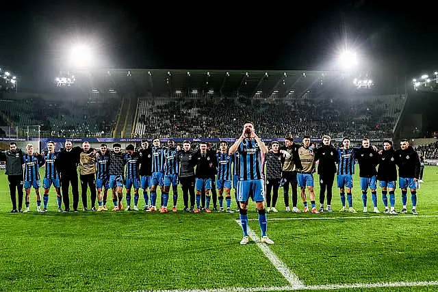 Club Brugge players celebrate with their fans