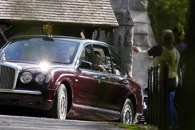 The King and Queen leaving the church in the back of the state Bentleyafter the hour-long service 