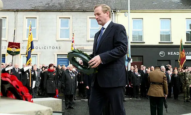 Then-taoiseach Enda Kenny prepares to lay a wreath at the cenotaph in Enniskillen in 2012 during a commemoration ceremony on the 25th anniversary of the IRA Poppy Day bomb attack which claimed the lives of 12 people 