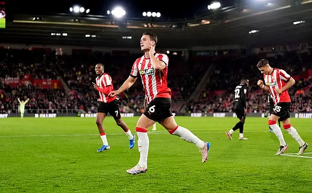 Taylor Harwood-Bellis puts his finger to his ear after scoring for Southampton