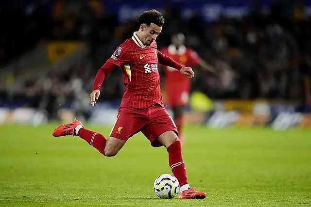 Liverpool midfielder Curtis Jones kicks the ball with his right foot