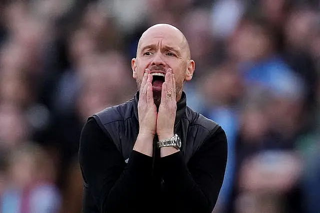 Manchester United boss Erik ten Hag puts his hands to his mouth in frustration