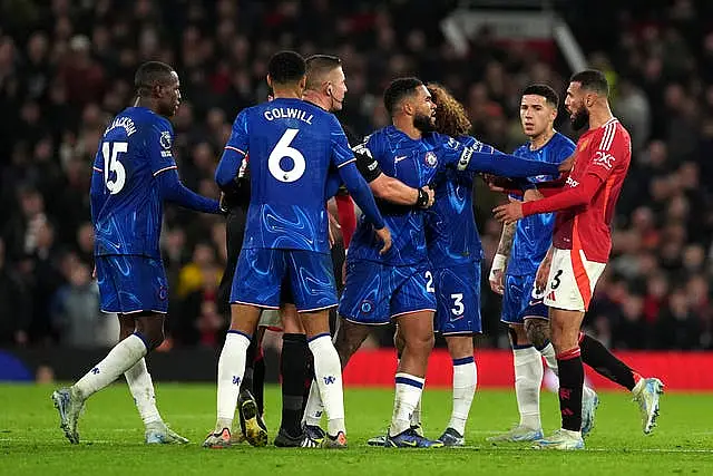 Noussair Mazraoui faces off with Chelsea's players