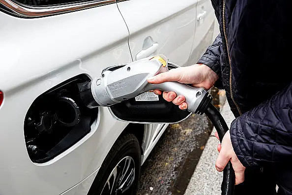 Go Ultra Low Electric Vehicle on charge on a London street