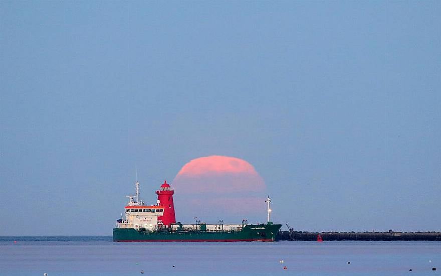 Pink Supermoon Lights Up The Dawn Skies