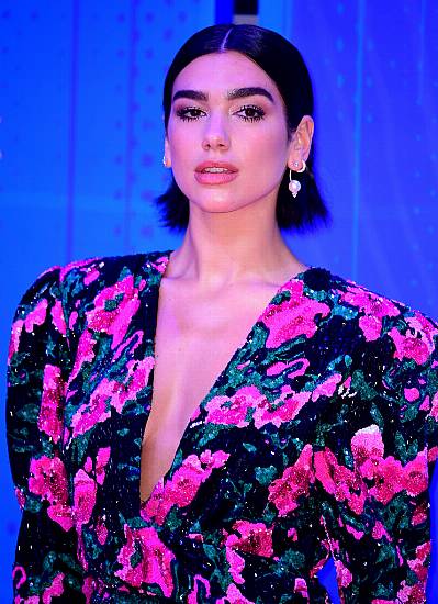 Dua Lipa Gives Nod To Amy Winehouse On Brit Awards Red Carpet