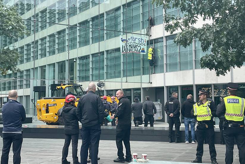 Protesters Scale Insurance Firm's Office Building In Central London