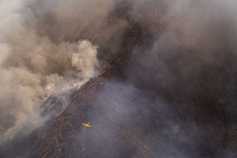 Rainfall Helps Firefighters Control Inferno In Southern Spain