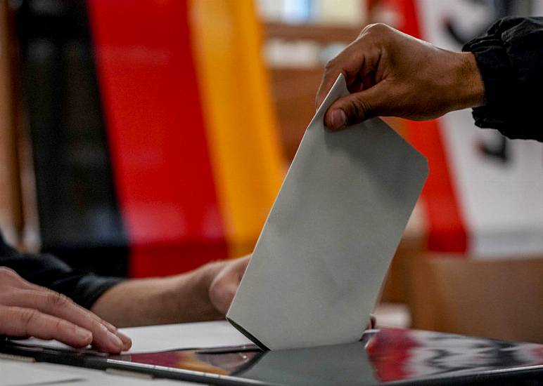 Exit Polls Suggest German Election Rivals Neck-And-Neck