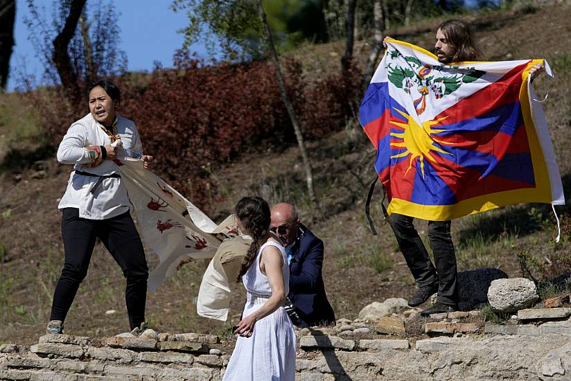 Protesters Denounce China At Winter Olympics Flame-Kindling Ceremony In Greece