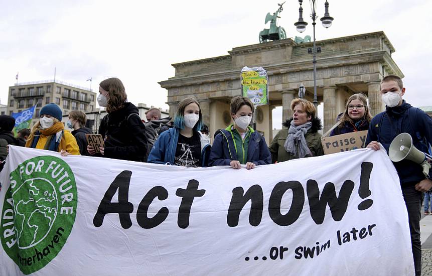 Campaigners Stage Climate Protests Across Continents