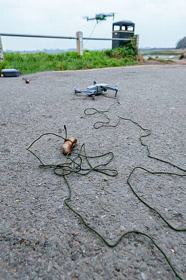 Stranded Dog Rescued With Sausage Dangled From Drone