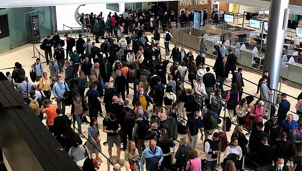 Passengers Queue Outside Terminal Buildings At Dublin Airport As 50,000 People Fly Abroad