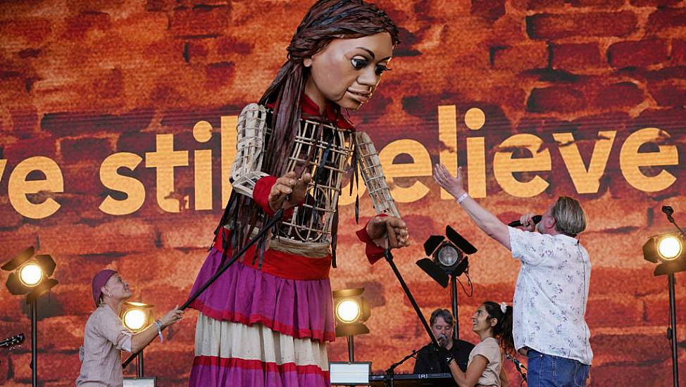 Elbow Joined By Little Amal And Refugee Choir At Glastonbury In ‘Special’ Moment