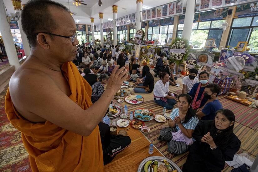 Mourners Pray At Thai Temple Filled With Keepsakes From Nursery Shooting Victims