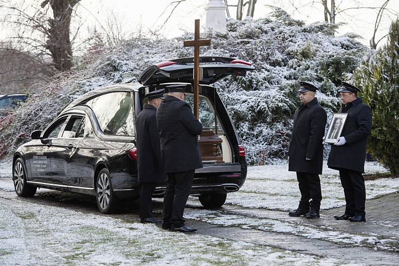 Funeral Held For First Of Two Poles Killed In Missile Blast