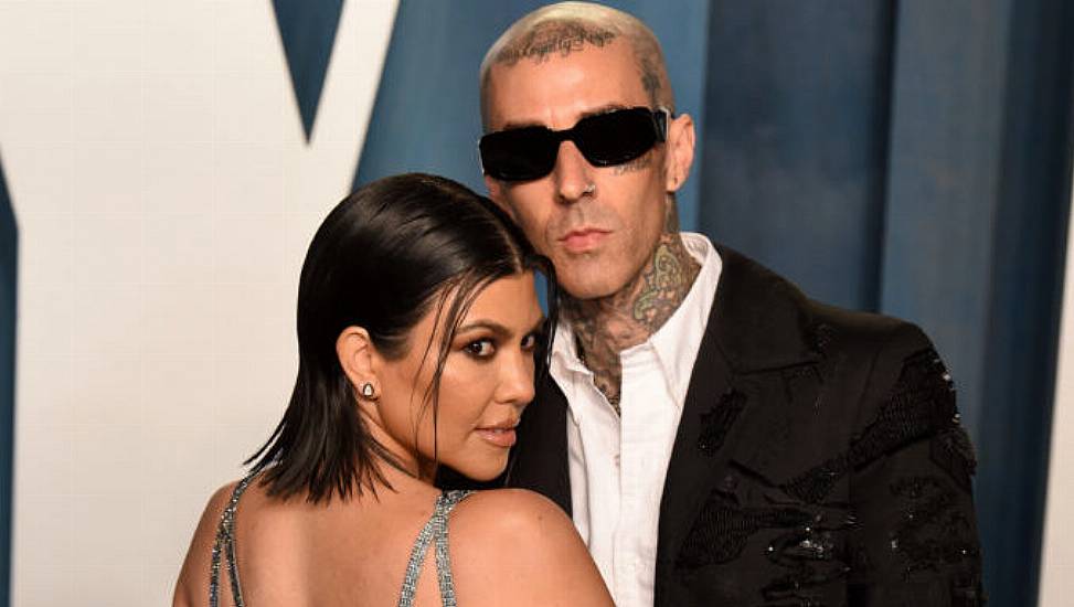 Kourtney Kardashian Reveals She's Pregnant To Travis Barker At Blink-182 Concert