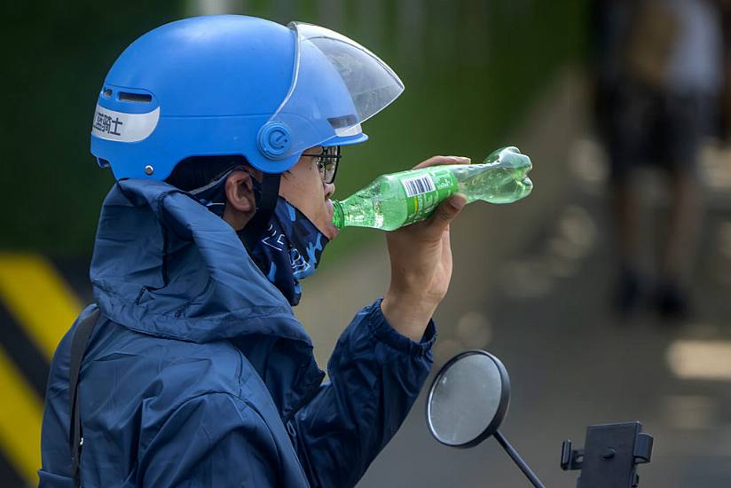 People Urged To Stay Indoors As Beijing Sizzles Amid 40-Degree Heatwave