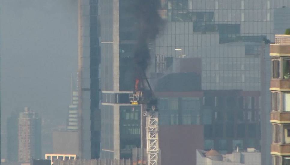 Pedestrians Scatter As Fire Causes New York Crane Arm To Crash To Street