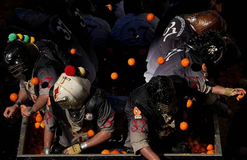 Pulp Flies In Traditional Orange Battle During Italian Carnival