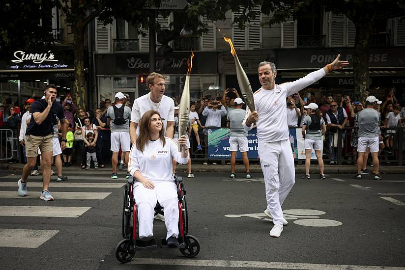 Wounded Lebanese Photojournalist Carries Olympic Torch To Honour Journalists