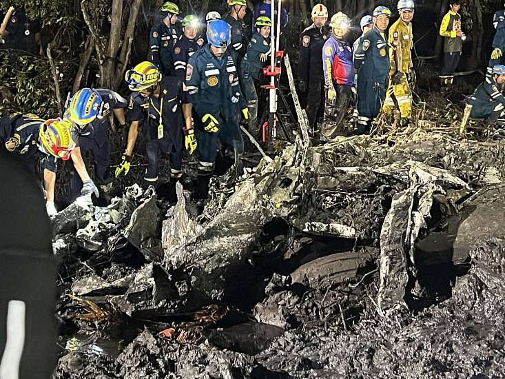 Searchers Dig In Muddy Swamp Where Tourist Plane Crashed Near Bangkok