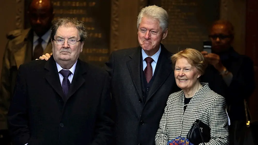 Former US president Bill Clinton (centre) with John Hume and his wife Pat at the Guildhall in Derry in 2014