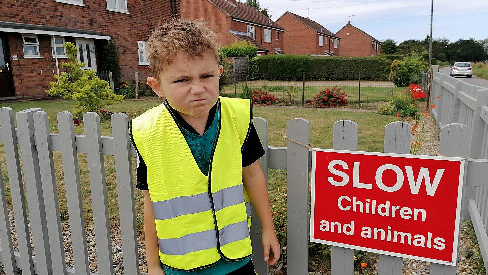 Seven-Year-Old Boy Polices Drivers Speeding Along His Road With ‘Stern Glare’