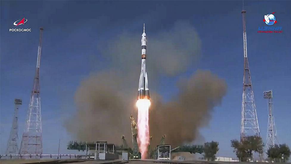 Crew Members Arrive At Space Station In Record Three Hours After Launch