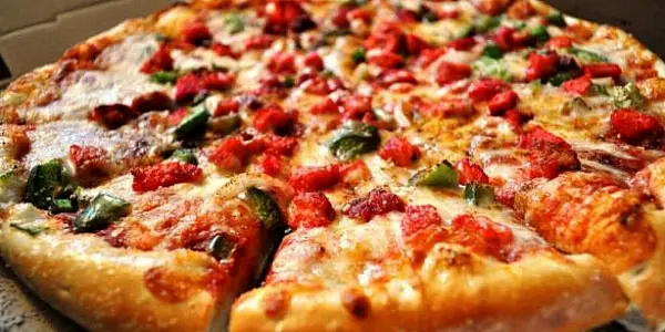 Domino's Pizza Claims Fourth Quarter Orders Boosted By Delivery And Discounts