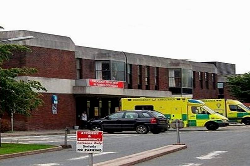 13 people wait on a bed at Cavan General Hospital