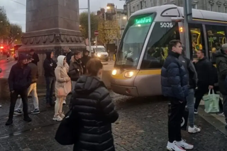 Riot police deployed in Dublin as Garda cars, Luas and Dublin Bus set alight